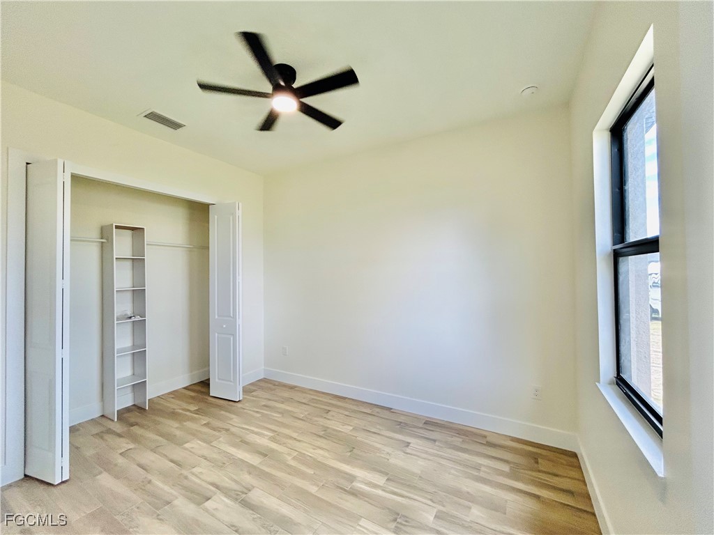 3804 6th Street Southwest Lehigh Acres, FL 33976 - Photo 24 of 45 a view of a room with a ceiling fan