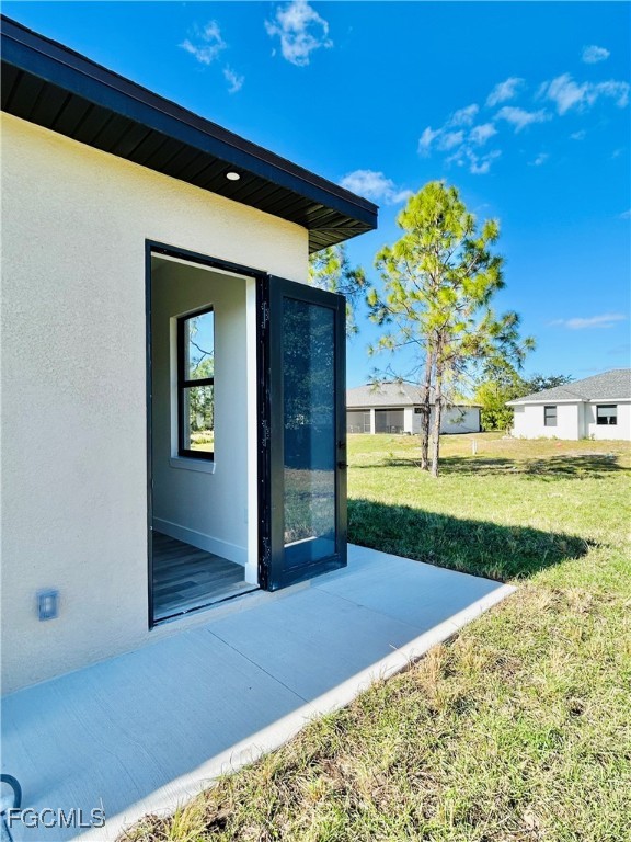 3804 6th Street Southwest Lehigh Acres, FL 33976 - Photo 30 of 45 a view of a porch with a yard