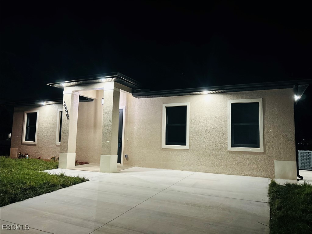 3804 6th Street Southwest Lehigh Acres, FL 33976 - Photo 44 of 45 a front view of a house with yard