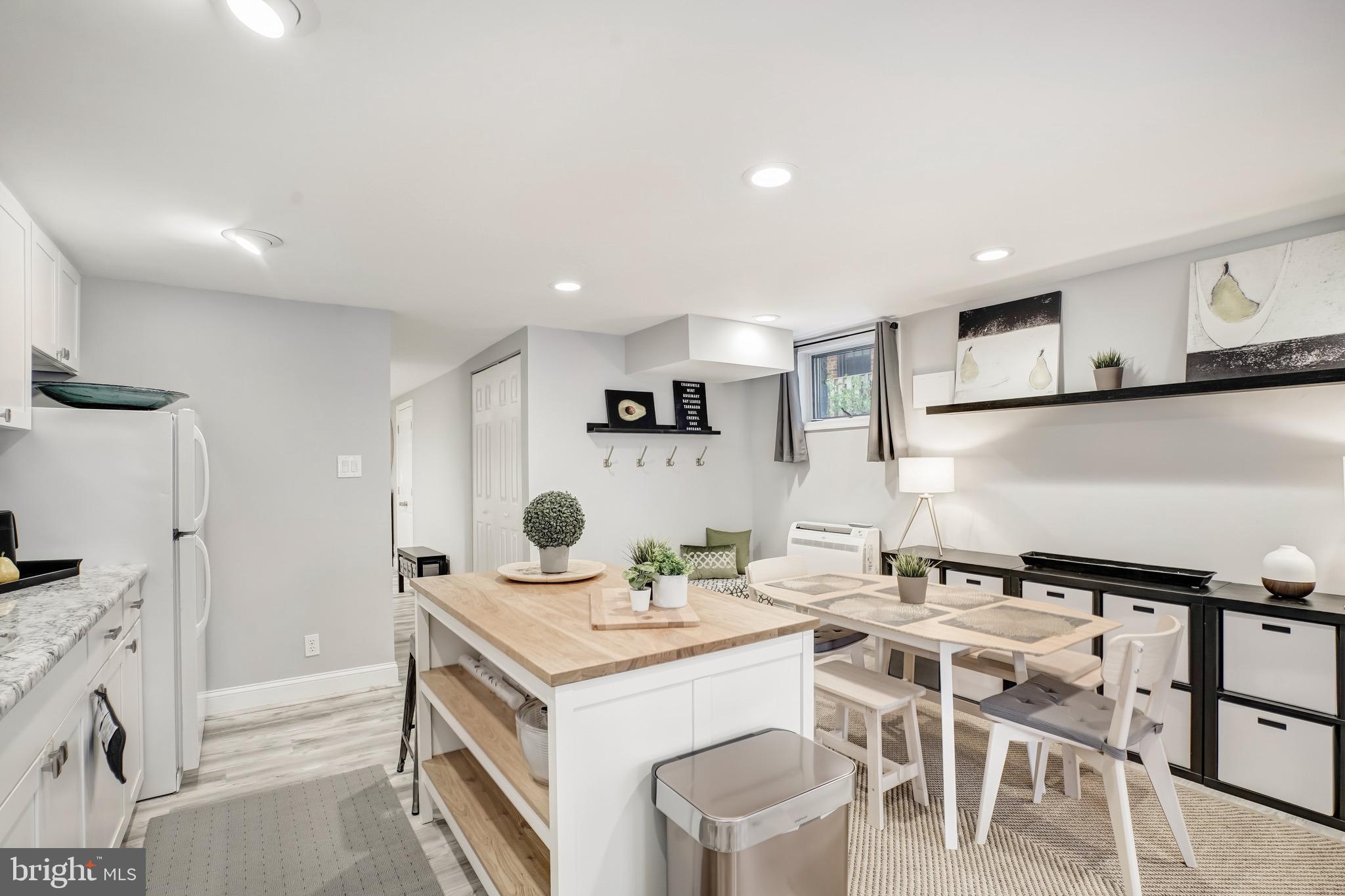 3817 Cathedral Avenue Northwest, Unit GARDEN Washington, DC 20016 - Photo 12 of 33 a kitchen that has a table and chairs in it