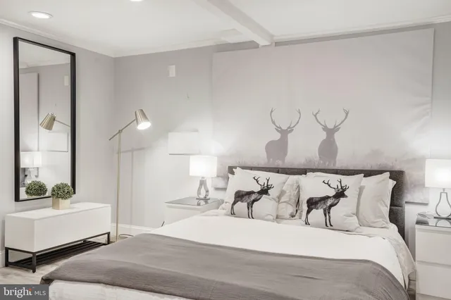 a bedroom with a large bed and a window