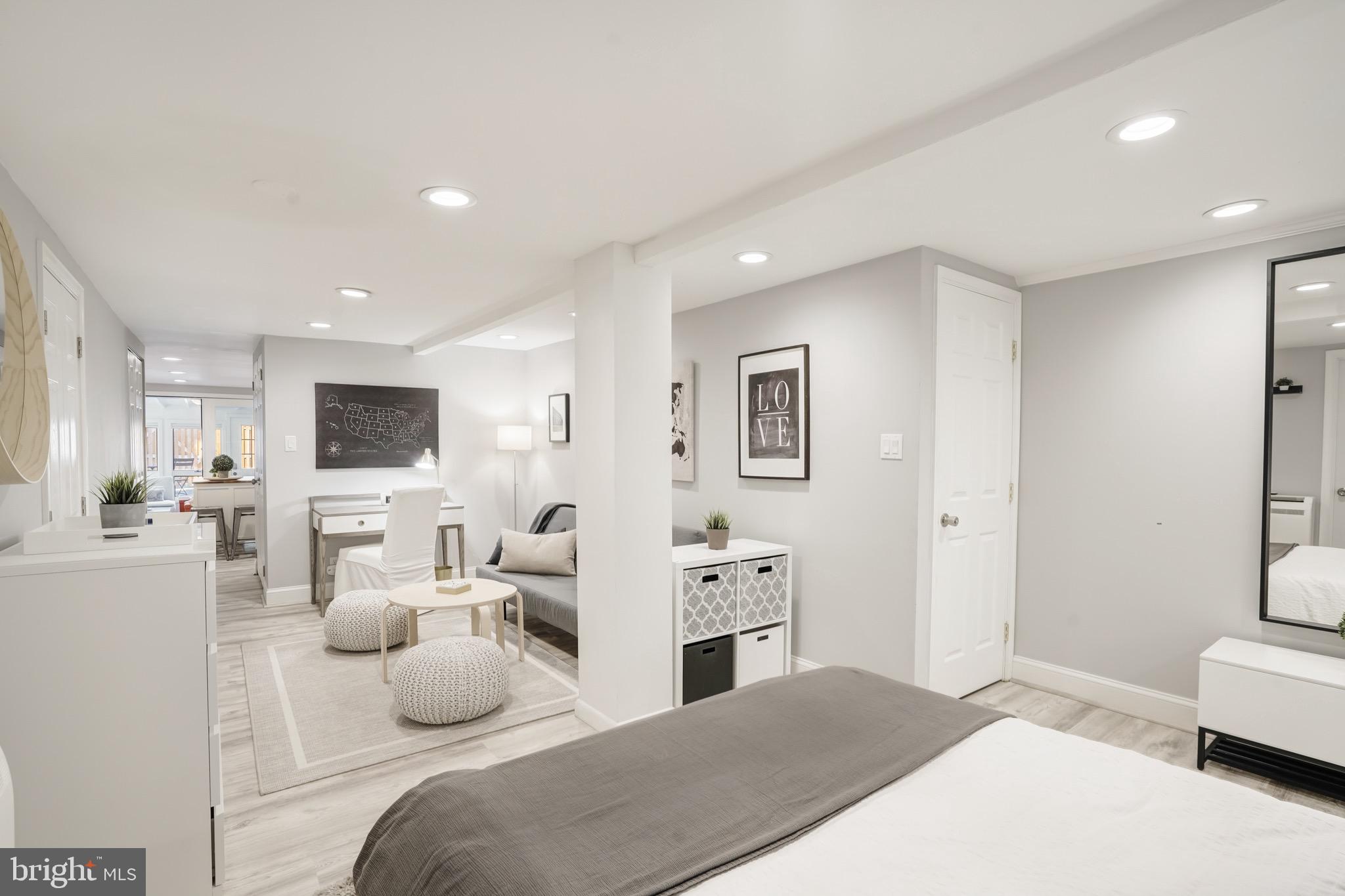 3817 Cathedral Avenue Northwest, Unit GARDEN Washington, DC 20016 - Photo 21 of 33 a bedroom with furniture and a bed