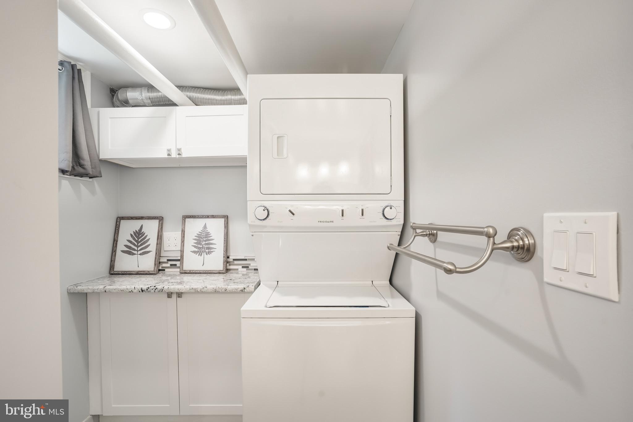 3817 Cathedral Avenue Northwest, Unit GARDEN Washington, DC 20016 - Photo 25 of 33 a utility room with dryer and washer