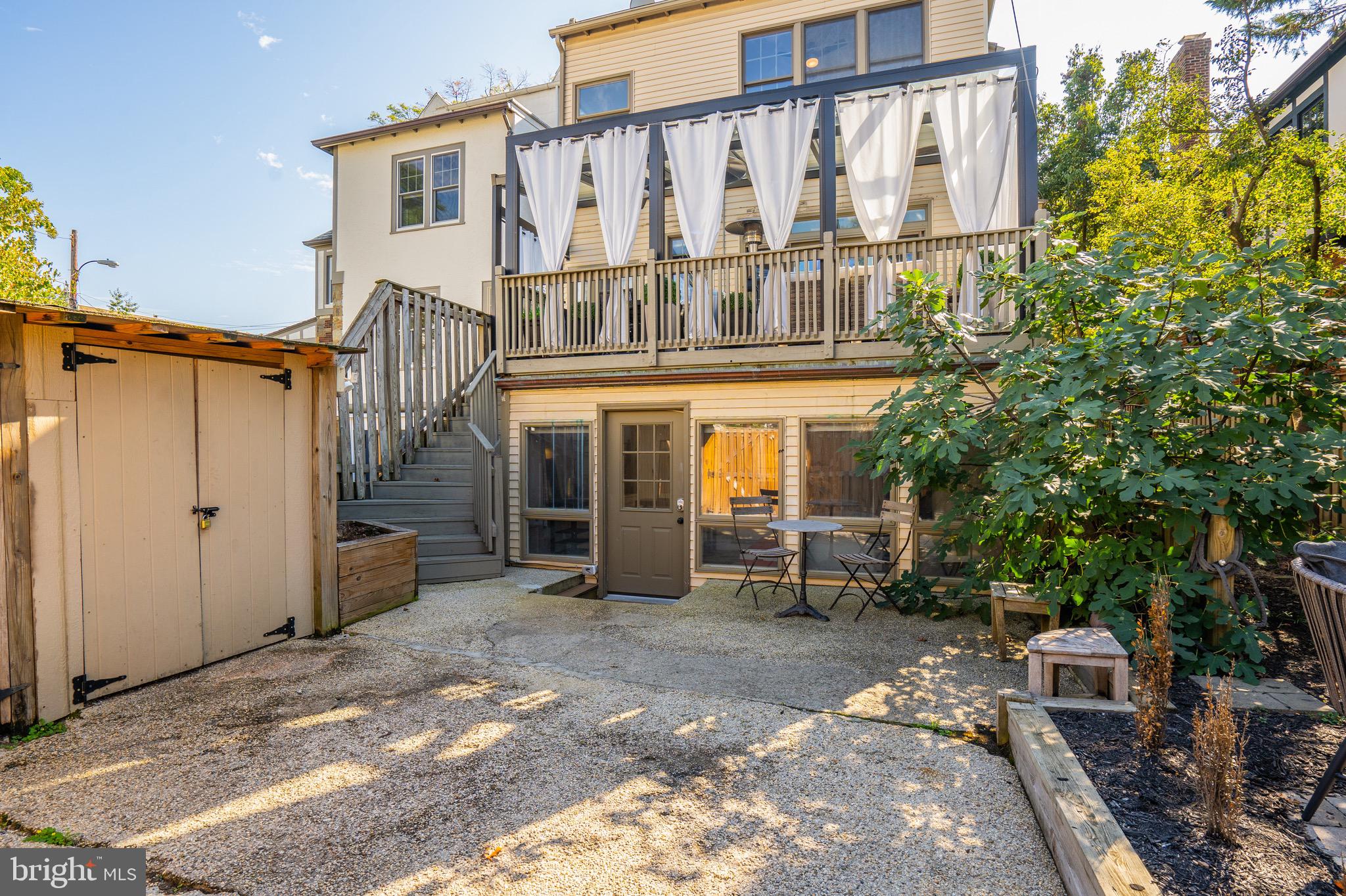 3817 Cathedral Avenue Northwest, Unit GARDEN Washington, DC 20016 - Photo 28 of 33 a view of a house with backyard and sitting area