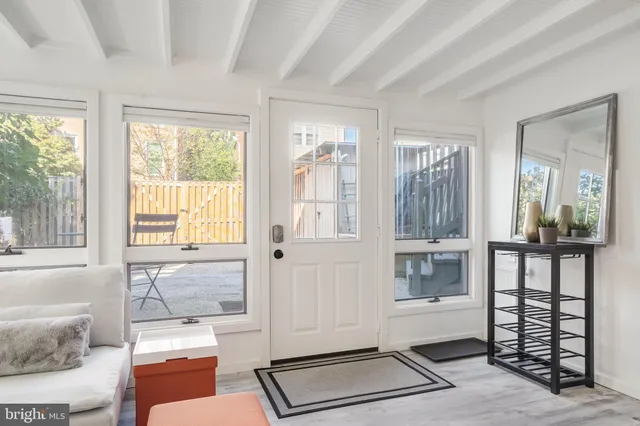 a living room with furniture and windows