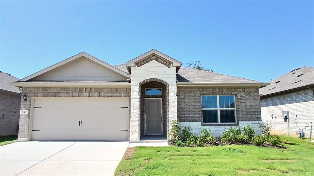 312 Logan Street Keene, TX 76059 - Photo 13 of 15 a front view of a house with garden