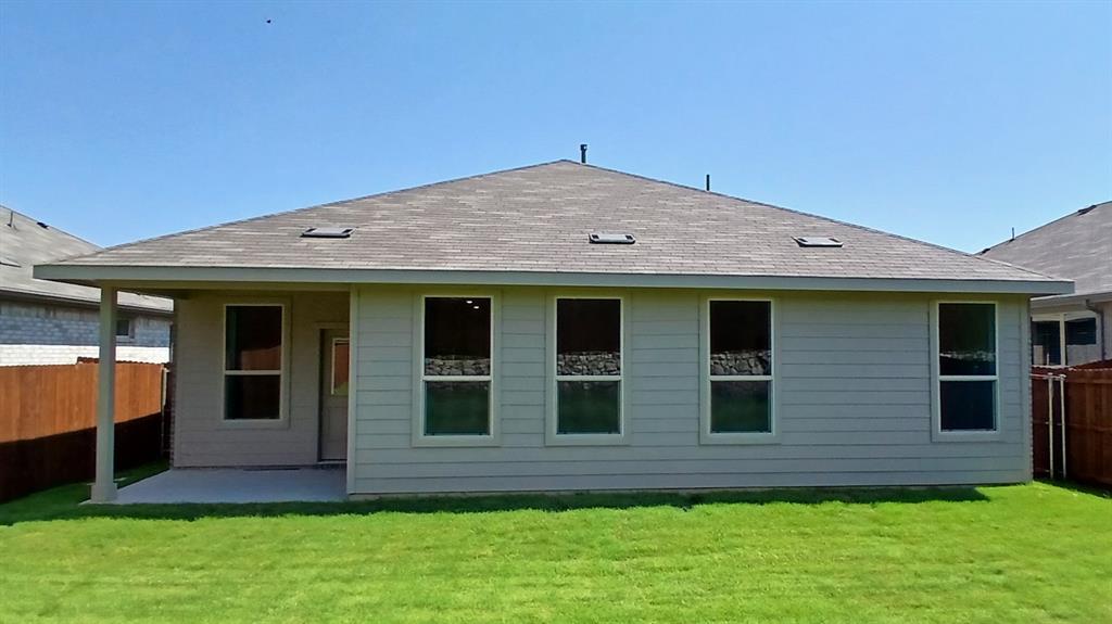 312 Logan Street Keene, TX 76059 - Photo 14 of 15 a view of a house with a garden