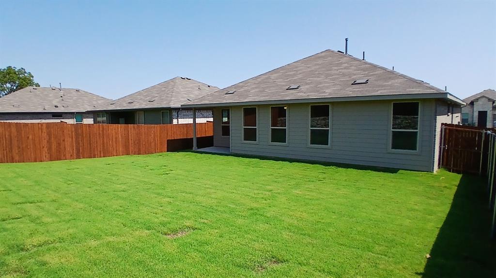 312 Logan Street Keene, TX 76059 - Photo 12 of 15 front view of a house with a yard