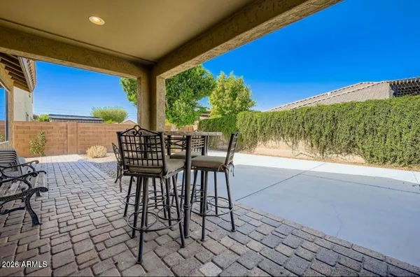 a view of a chairs and table in the patio