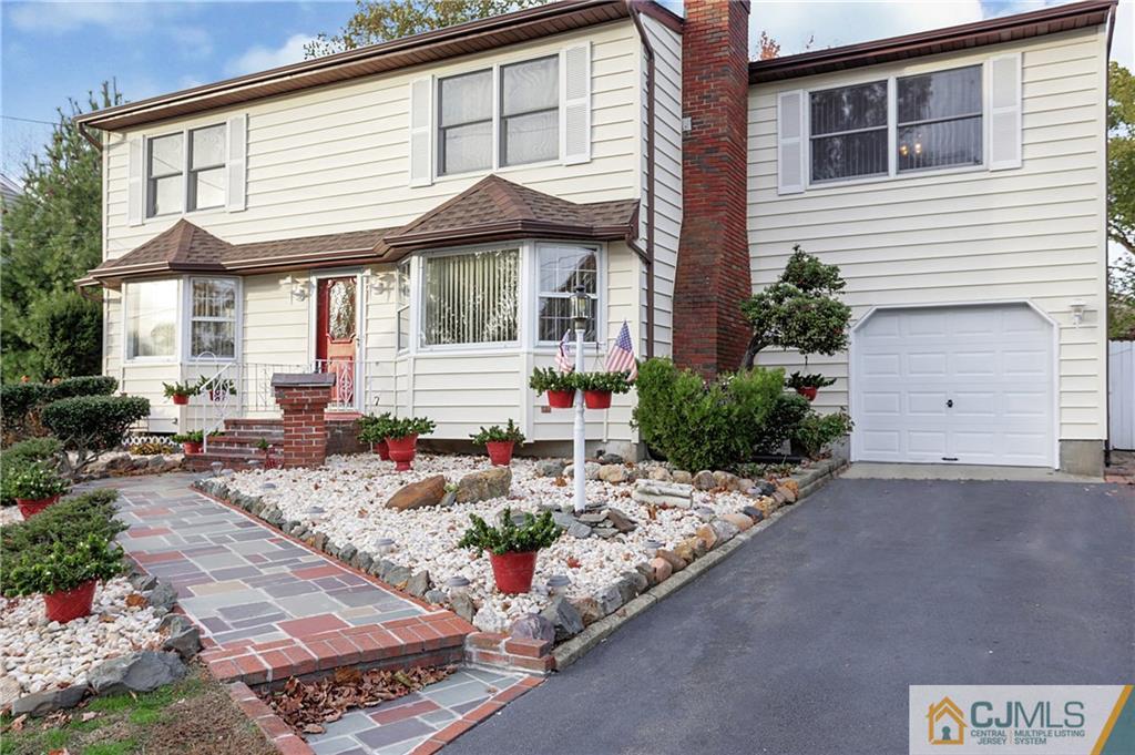 4 Channing Road East Brunswick, NJ 08816 - Photo 1 of 21 a front view of a house with garden