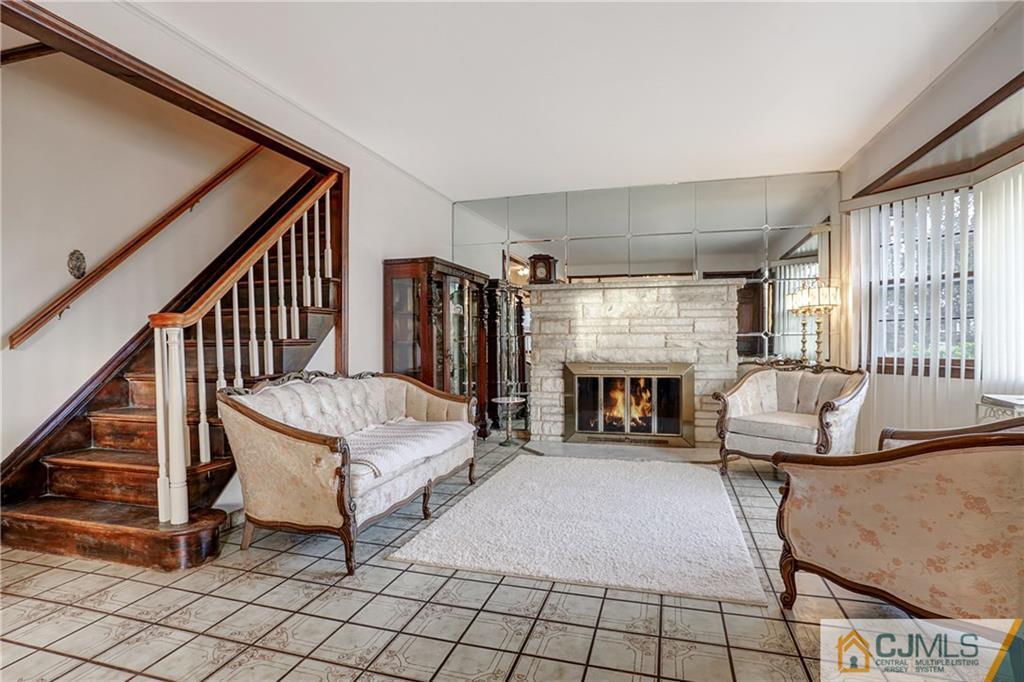4 Channing Road East Brunswick, NJ 08816 - Photo 2 of 21 a living room with furniture and a fireplace