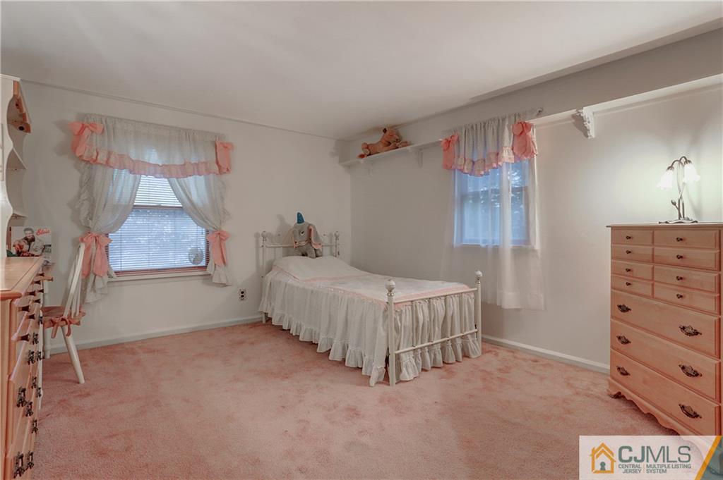 4 Channing Road East Brunswick, NJ 08816 - Photo 16 of 21 a bedroom with a bed and a cabinets