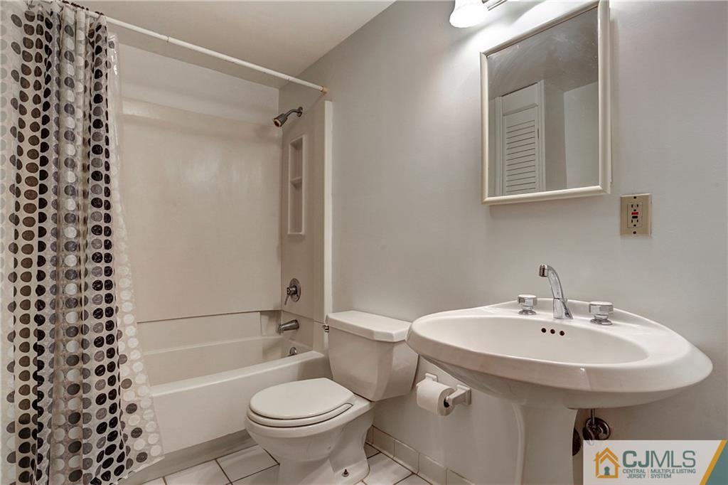 4 Channing Road East Brunswick, NJ 08816 - Photo 17 of 21 a bathroom with a sink toilet and shower