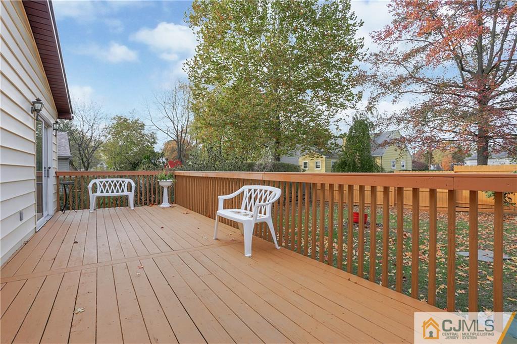4 Channing Road East Brunswick, NJ 08816 - Photo 18 of 21 a balcony with wooden floor table and chairs
