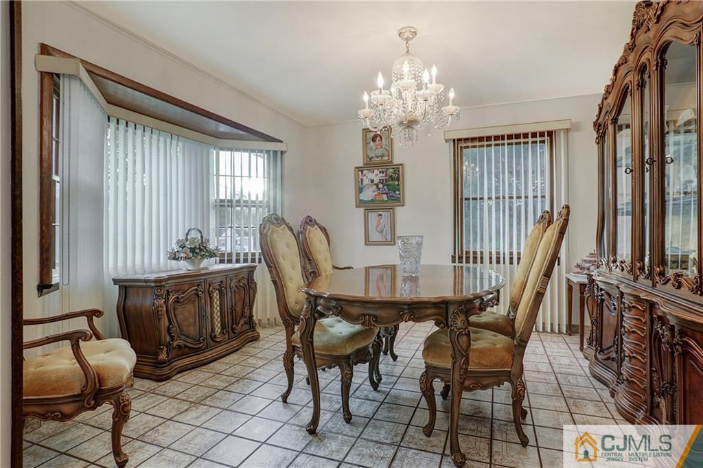 4 Channing Road East Brunswick, NJ 08816 - Photo 4 of 21 a view of a dining room with furniture window and outside view
