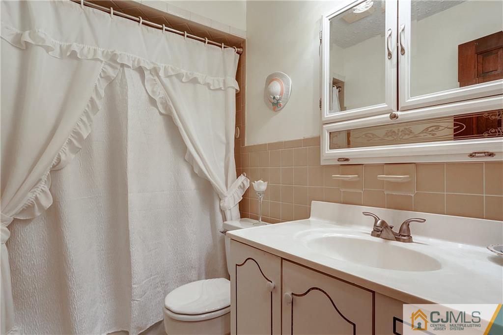4 Channing Road East Brunswick, NJ 08816 - Photo 5 of 21 a bathroom with a sink toilet and shower