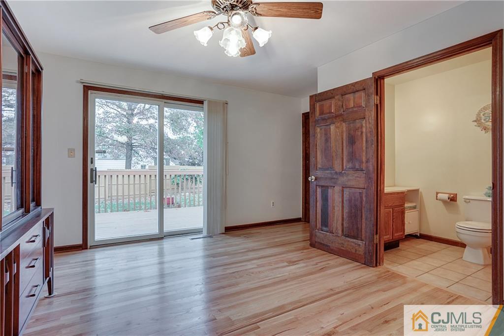 4 Channing Road East Brunswick, NJ 08816 - Photo 7 of 21 an empty room with wooden floor fan and windows