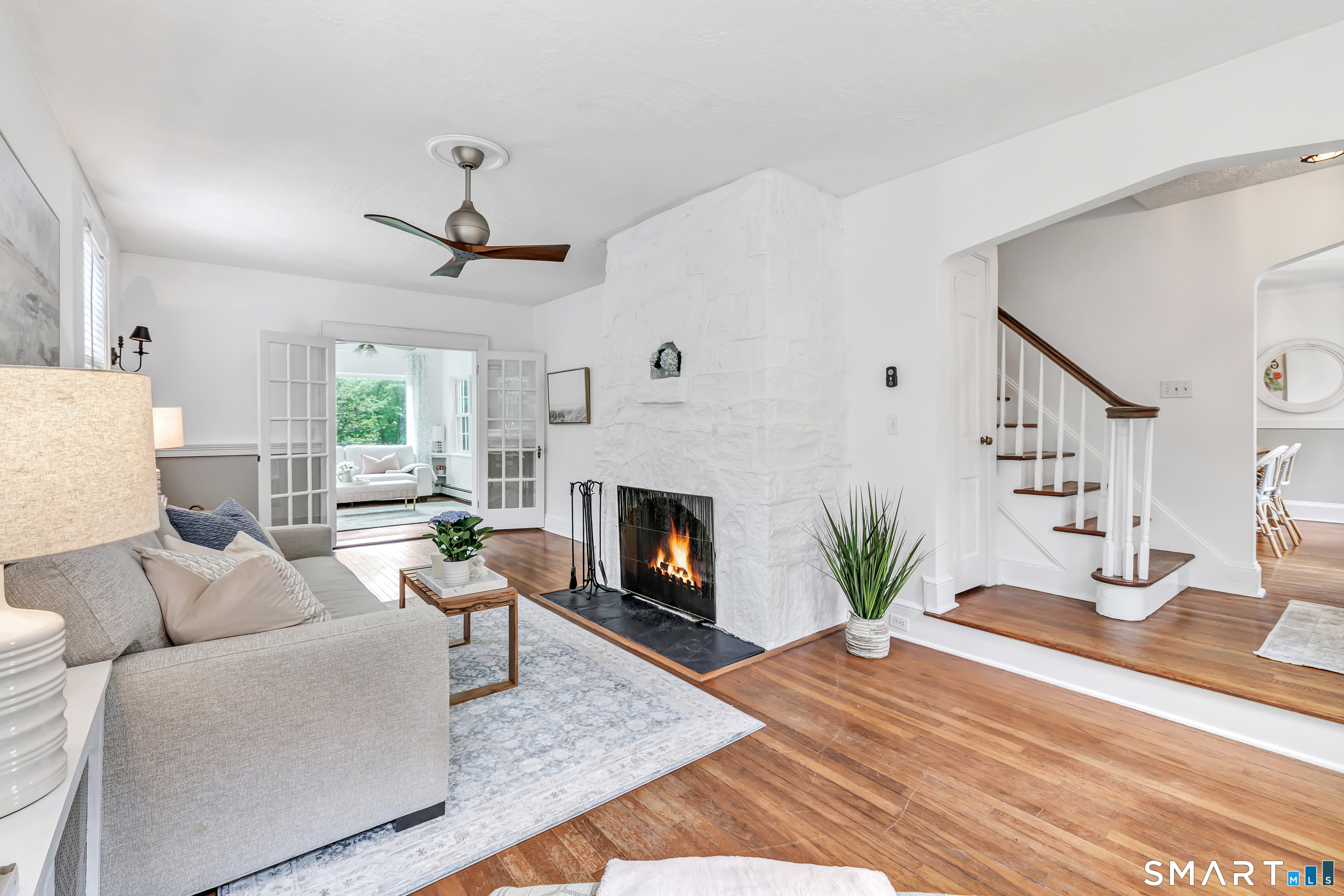 464 Round Hill Road Fairfield, CT 06824 - Photo 10 of 40 Elegant living room with woodburning fireplace.