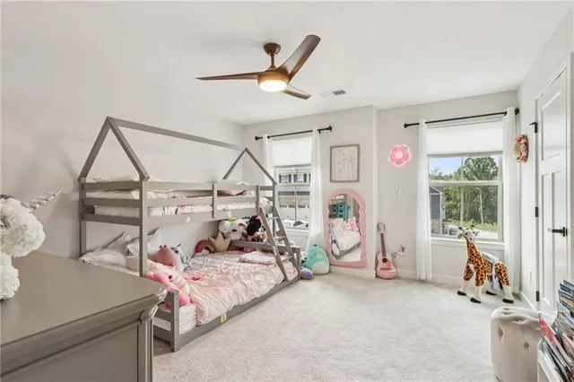 a bed room with a bed and a window