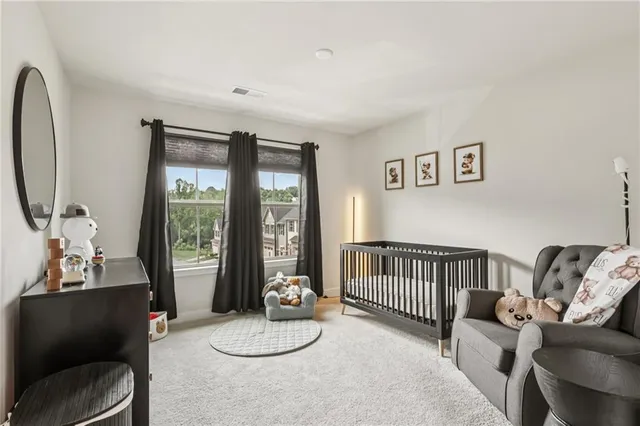 a bedroom with furniture and a window