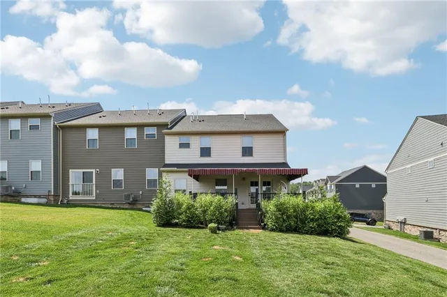 a view of a house with a yard and plants