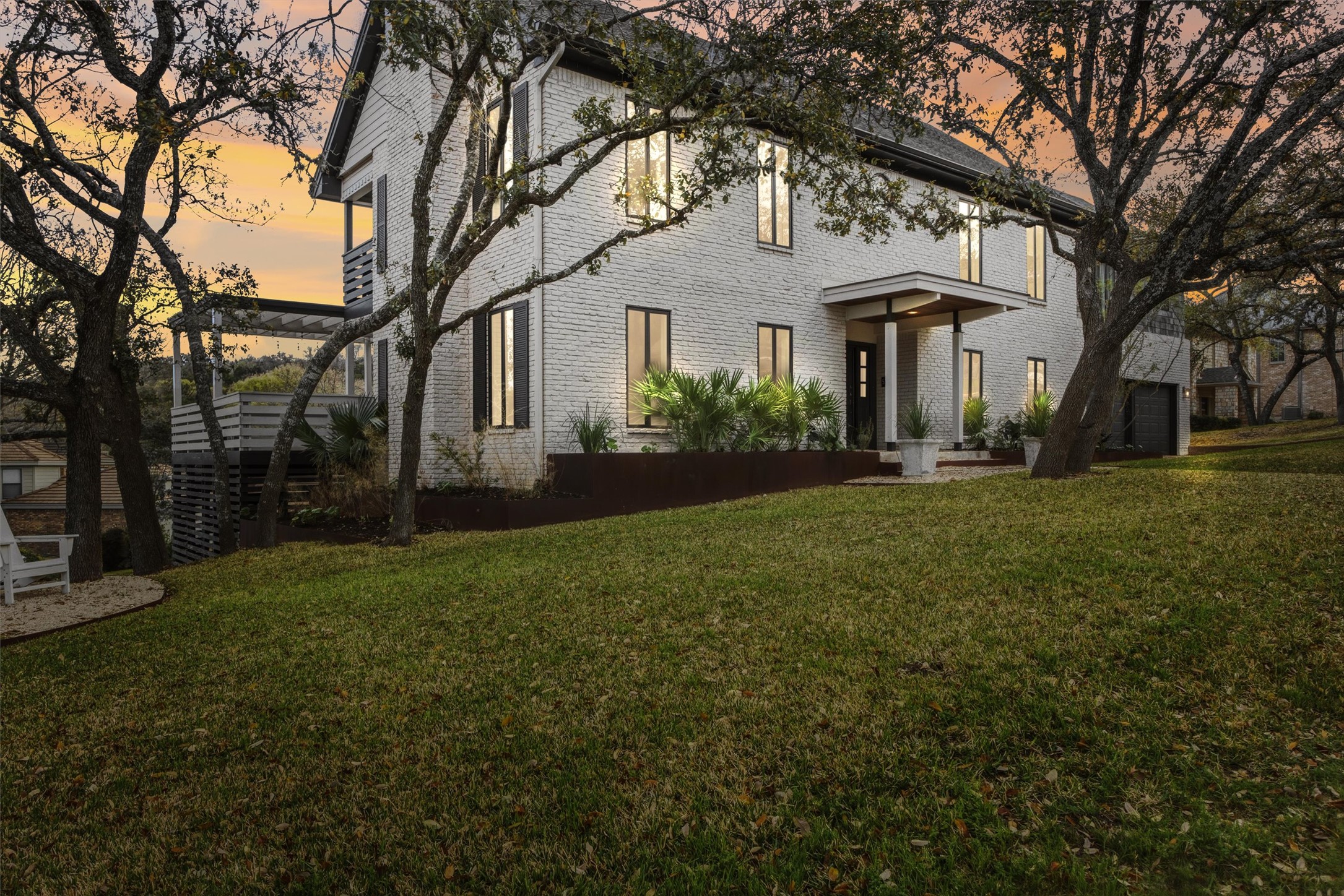 a front view of a house with garden