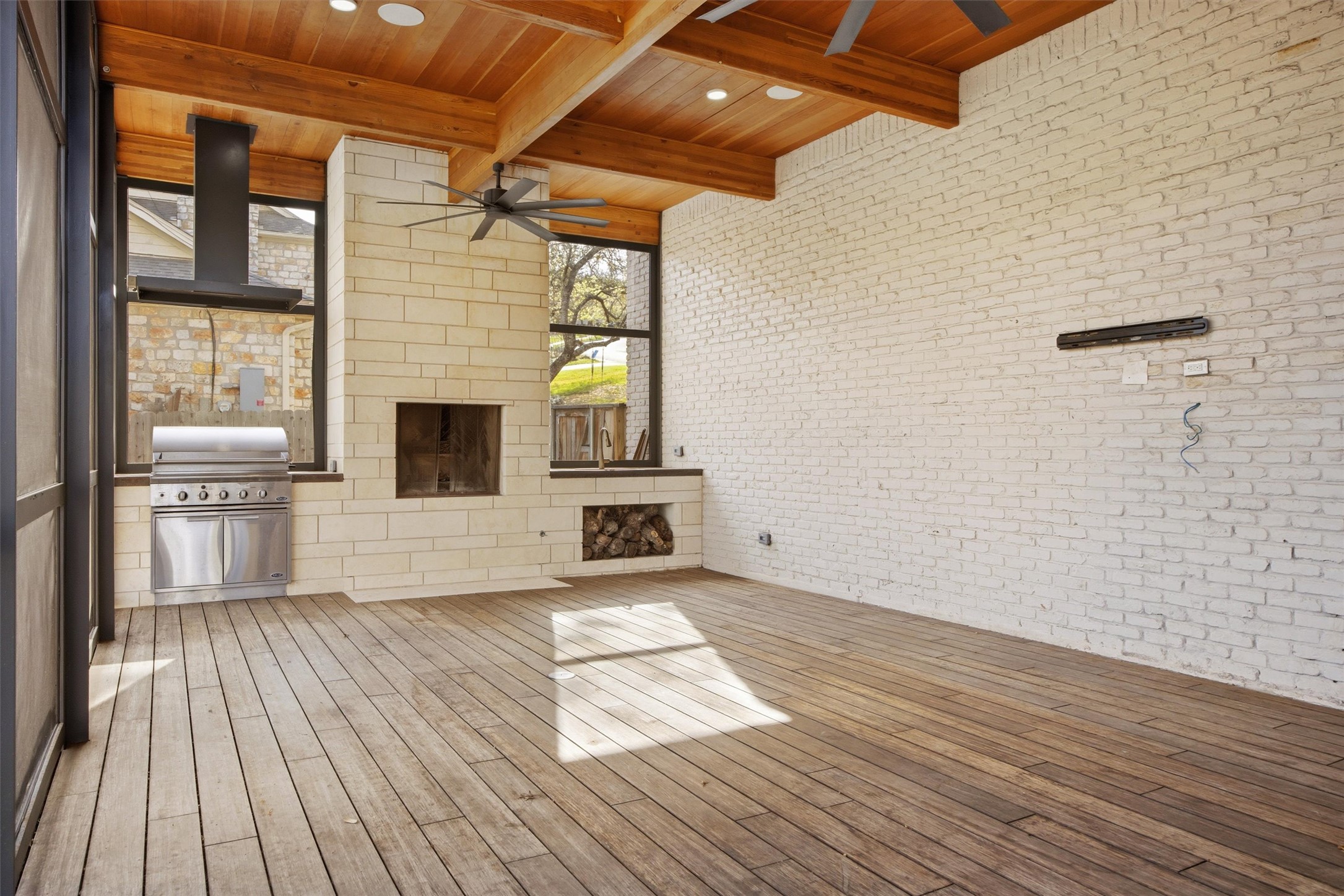 5705 Carry Back Lane Austin, TX 78746 - Photo 11 of 39 a view of empty room with wooden floor and fireplace