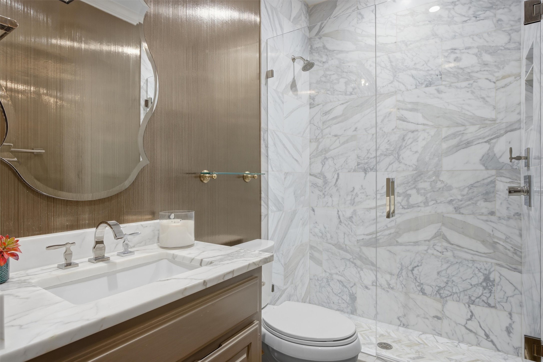 5705 Carry Back Lane Austin, TX 78746 - Photo 16 of 39 a bathroom with a granite countertop sink a toilet and shower