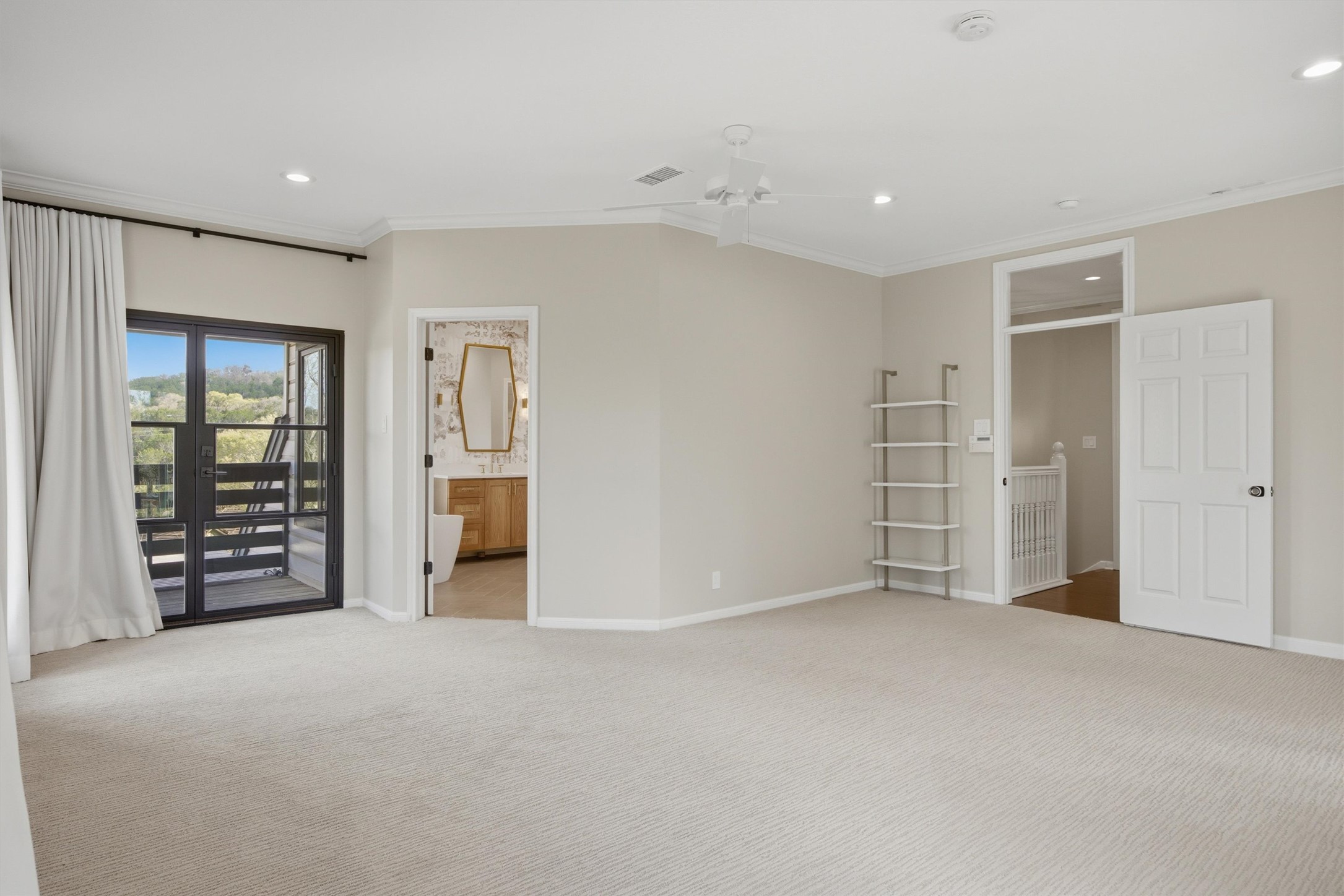 5705 Carry Back Lane Austin, TX 78746 - Photo 22 of 39 an empty room with closet and a window