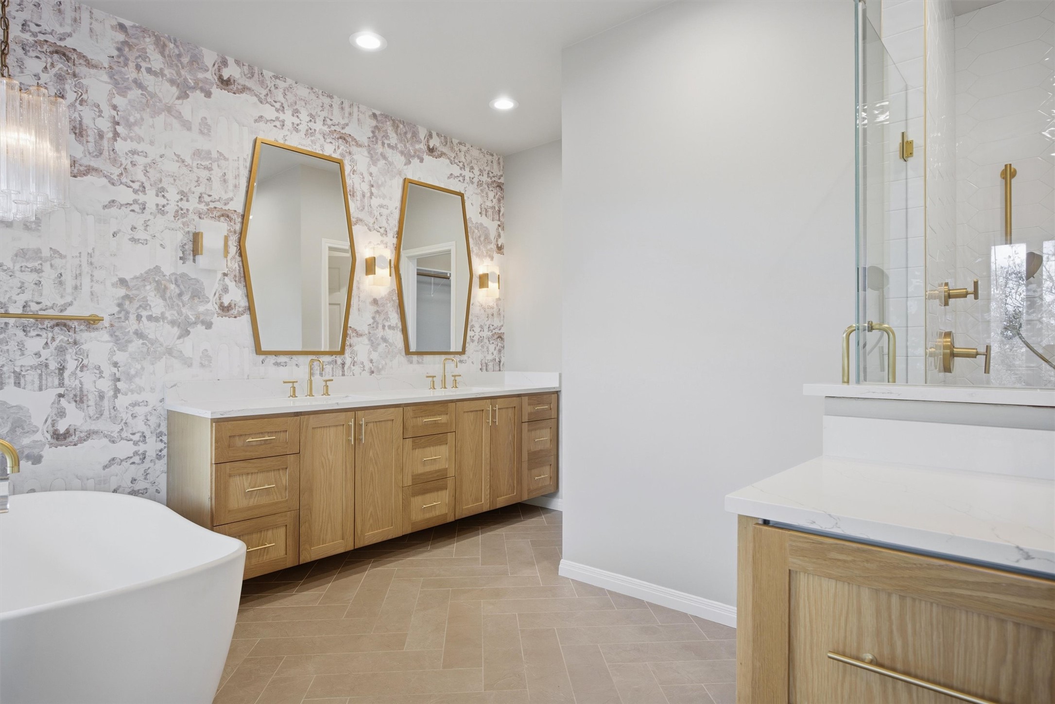 5705 Carry Back Lane Austin, TX 78746 - Photo 23 of 39 a spacious bathroom with a double vanity sink mirror and bathtub