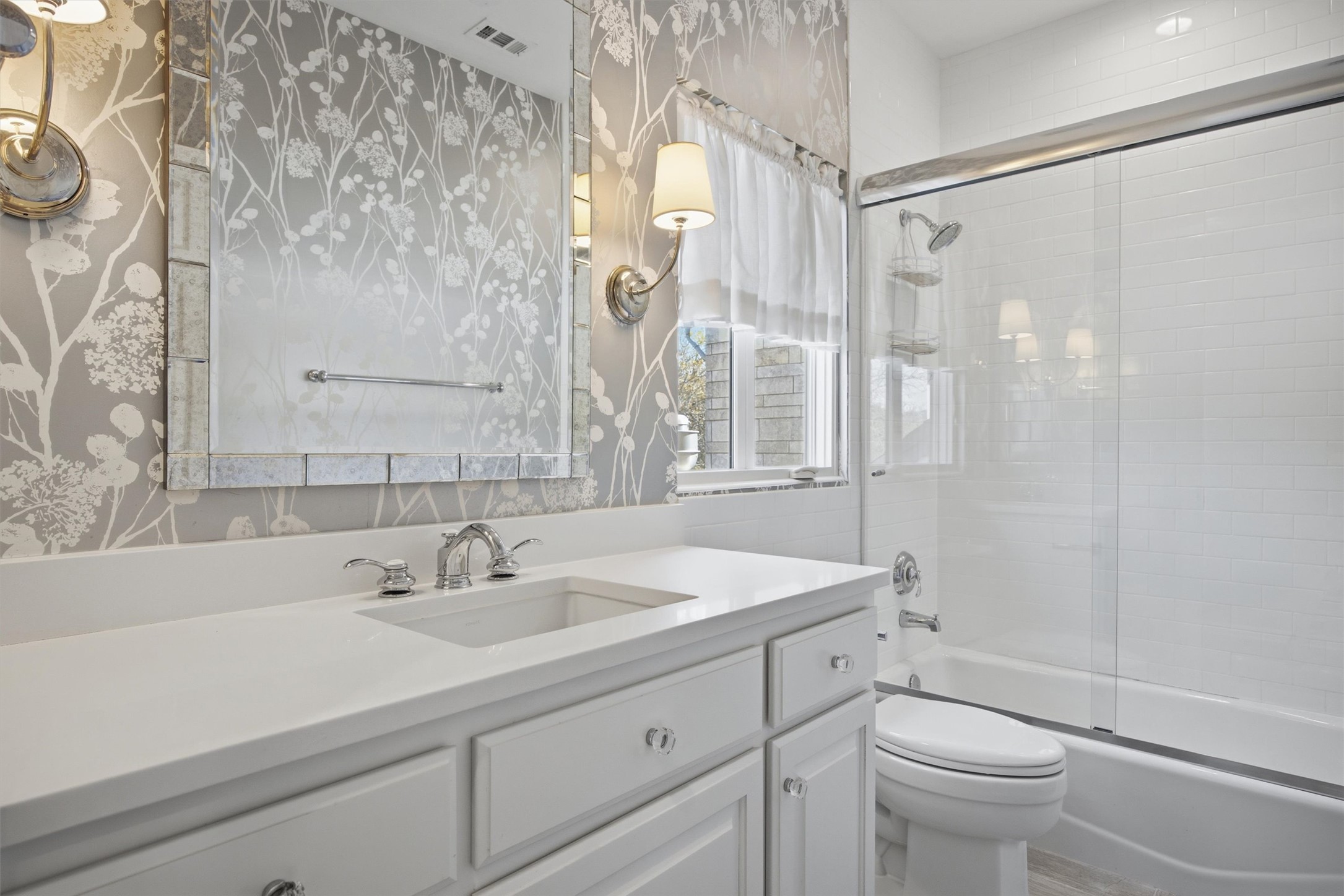 5705 Carry Back Lane Austin, TX 78746 - Photo 28 of 39 a bathroom with a sink a toilet and a shower