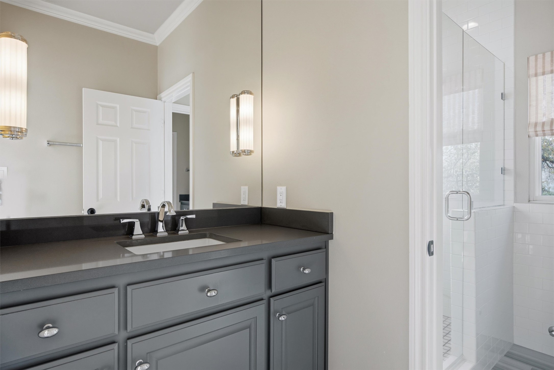 5705 Carry Back Lane Austin, TX 78746 - Photo 31 of 39 a bathroom with double sink and a mirror