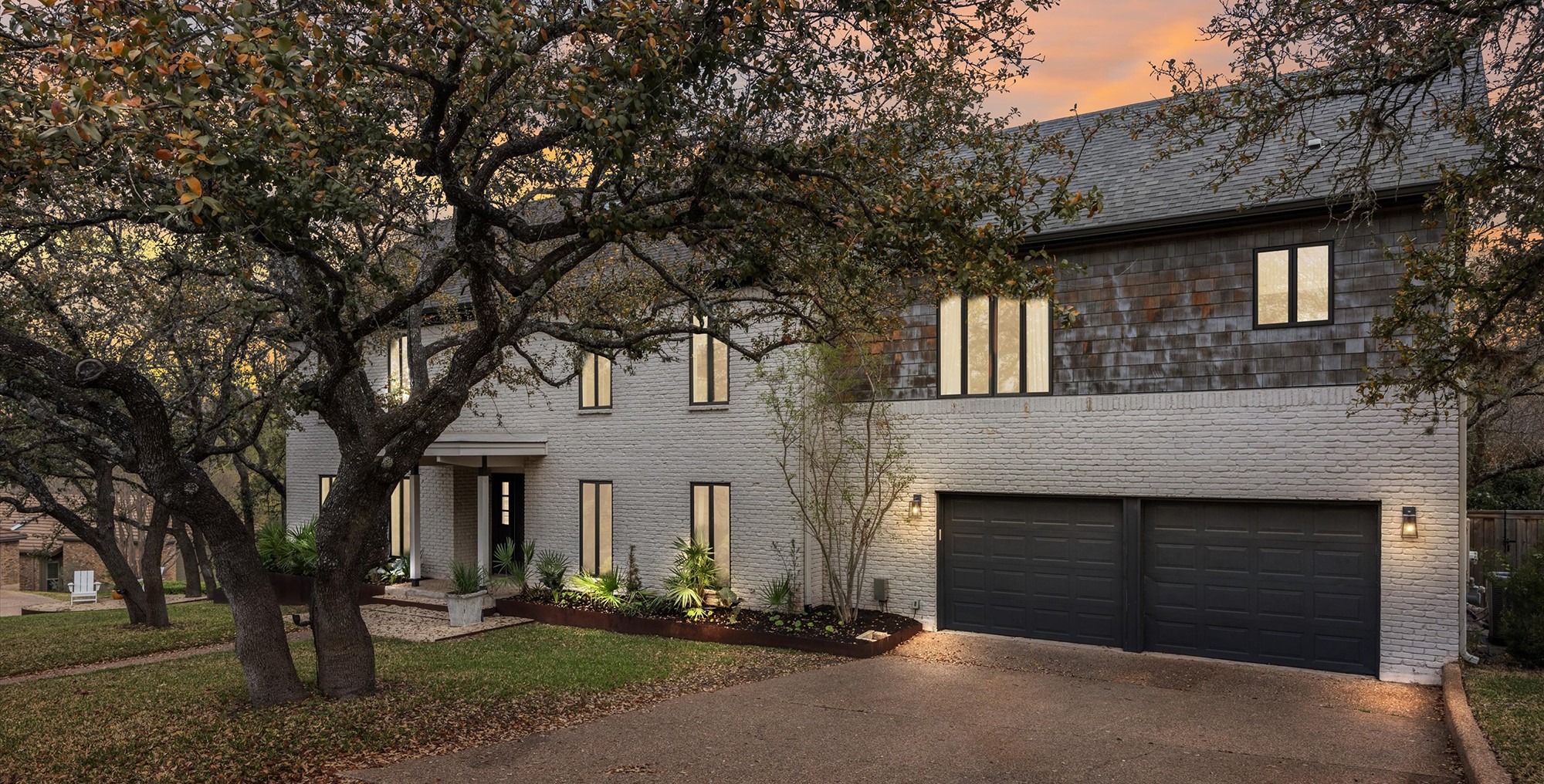 5705 Carry Back Lane Austin, TX 78746 - Photo 39 of 39 a front view of a house with a yard