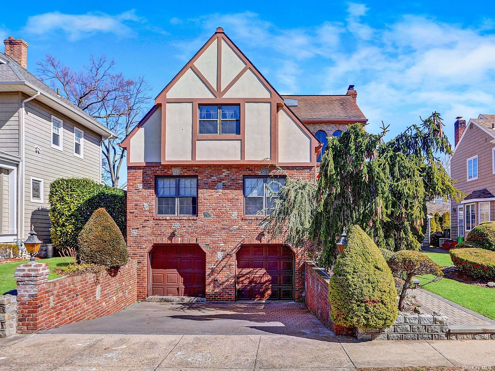 127 Roxbury Road Garden City, NY 11530 - Photo 1 of 1 a front view of a house with a yard