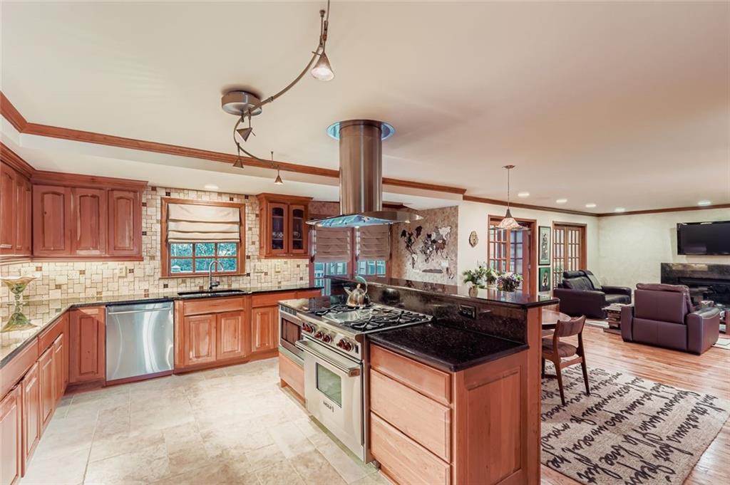 3778 Guilford Court Decatur, GA 30034 - Photo 11 of 29 a kitchen with kitchen island granite countertop a sink counter and appliances