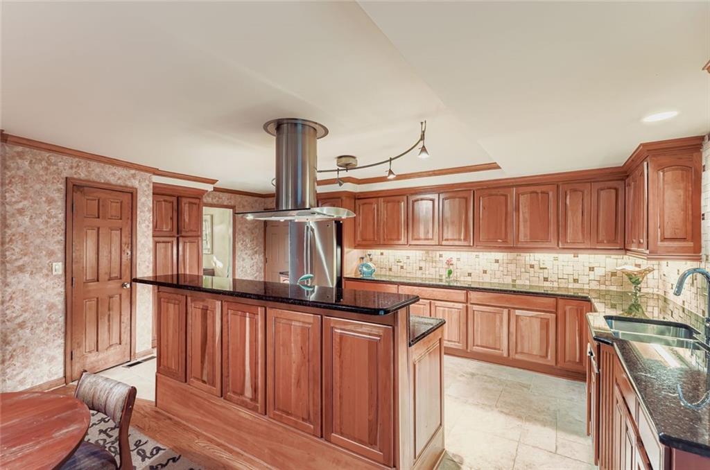 3778 Guilford Court Decatur, GA 30034 - Photo 12 of 29 a kitchen with granite countertop a sink stainless steel appliances and cabinets