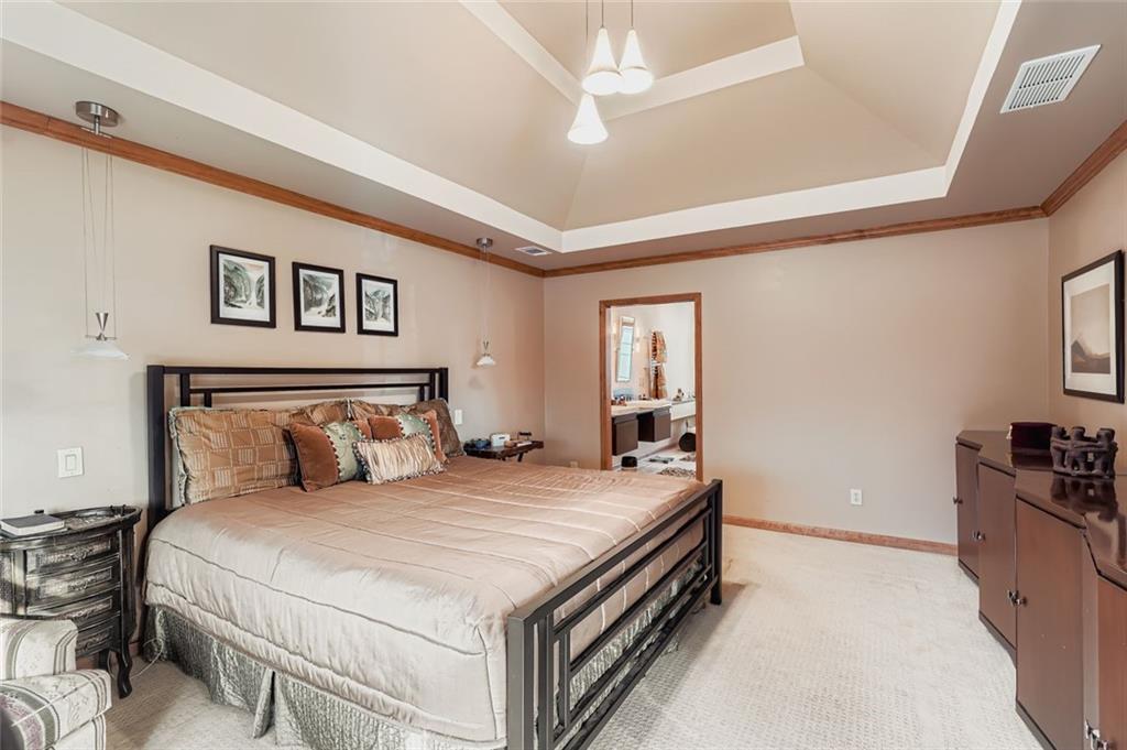 3778 Guilford Court Decatur, GA 30034 - Photo 17 of 29 a bedroom with a bed and a chandelier