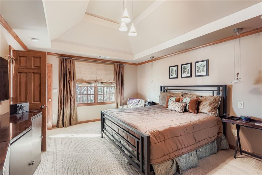 3778 Guilford Court Decatur, GA 30034 - Photo 18 of 29 a bedroom with a large bed and a chandelier