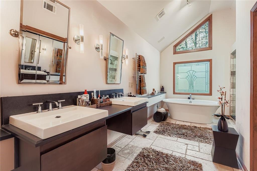 3778 Guilford Court Decatur, GA 30034 - Photo 19 of 29 a bathroom with a tub sink and mirror