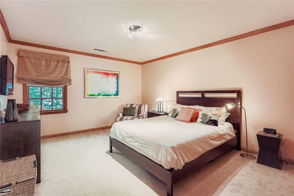 3778 Guilford Court Decatur, GA 30034 - Photo 22 of 29 a bedroom with a bed lamp on desk and a window