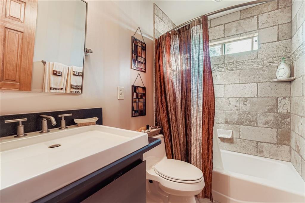 3778 Guilford Court Decatur, GA 30034 - Photo 23 of 29 a bathroom with a sink a toilet and shower