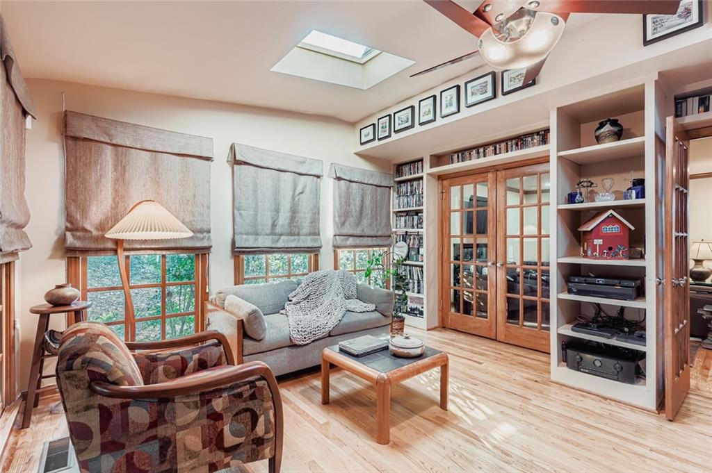 3778 Guilford Court Decatur, GA 30034 - Photo 25 of 29 a living room with furniture a rug and a floor to ceiling window