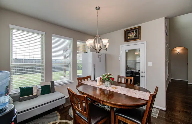 a view of a dining room with furniture window and outside view