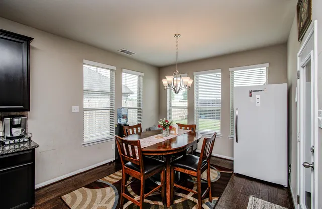 a view of a dining room with furniture window and outside view