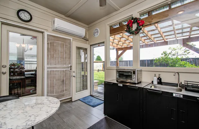 a very nice looking room with a large window and chandelier