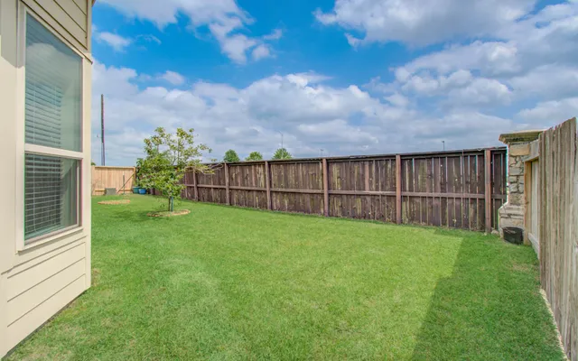 a view of a backyard with a garden