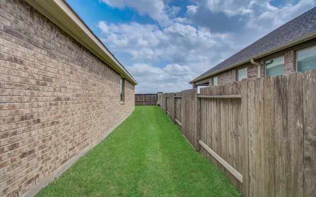 a backyard of a house with lots of green space