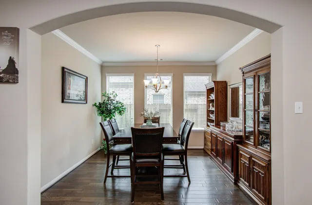 a view of a dining room with furniture and window