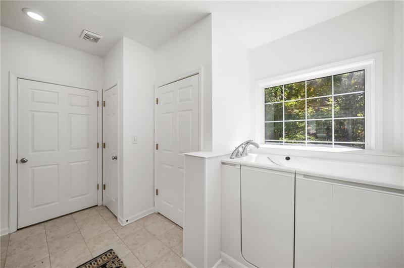 16218 Henderson Road Milton, GA 30004 - Photo 32 of 81 a view of an empty room with a window