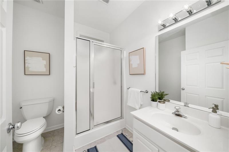 16218 Henderson Road Milton, GA 30004 - Photo 36 of 81 a bathroom with a sink toilet and vanity